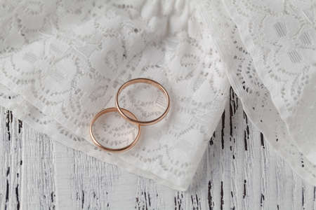 The rings on the flowers on a white fabric, wedding detailsの写真素材