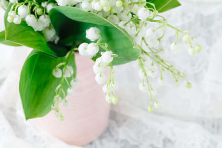Bouquet of lilies of the valley on a grunge wooden  backgroundの写真素材