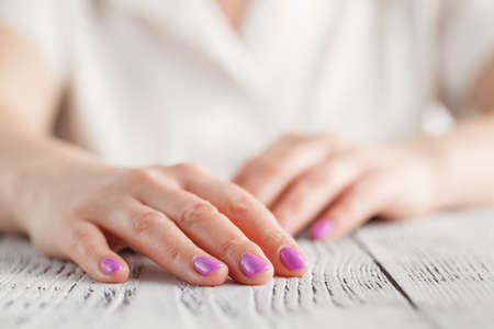 Woman's hands with beautiful manicure on white background.の写真素材