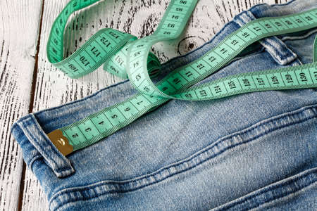 tape measuring on jeansの写真素材