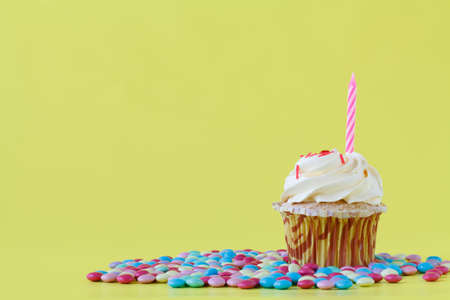 Birthday cupcake with one candleの写真素材