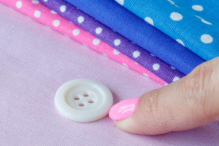 Female hand choosing b??tonの写真素材