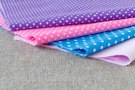Colorful fabric samples on wooden tableの写真素材