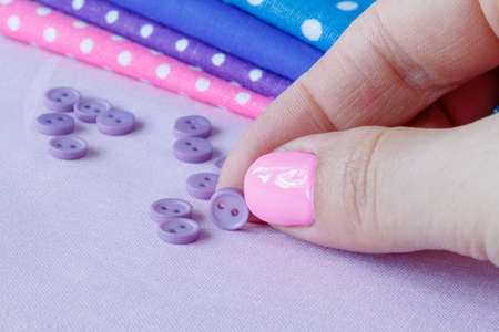 Female hand choosing b??tonの写真素材