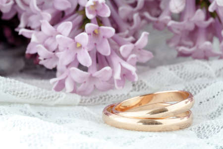 wedding ring against flower backgroundの写真素材