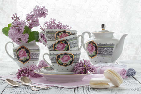 Romantic background with cup of tea ,lilac flowersの写真素材