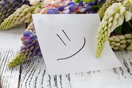 Lovely bouquet or bunch of lupines with notesの写真素材