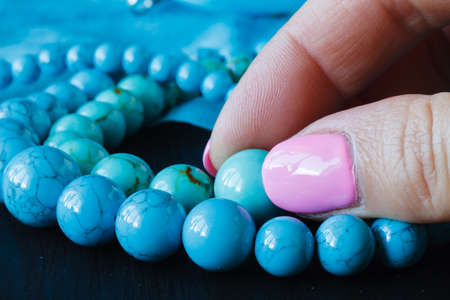 ewelry made of turquoise on a woman's handの写真素材