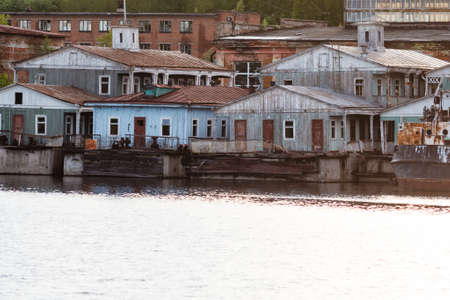 Old pontoon house on river, Landing stage