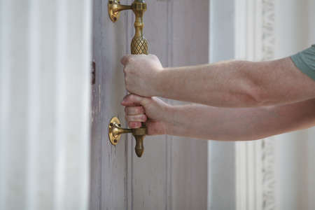 Man open the door, horizontal photo.の写真素材