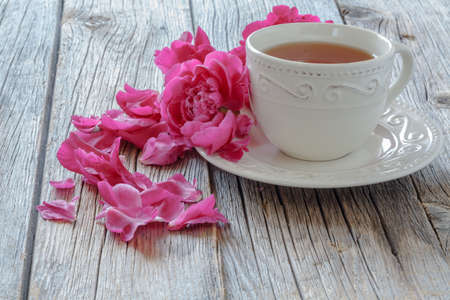 Flowers and a cup of teaの写真素材