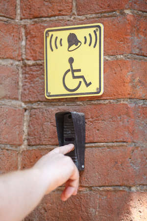 Call button for the disabled built-in wall marked yellow tabletsの写真素材