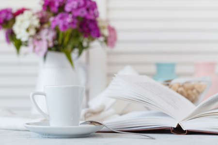 Still life details, cup of tea on retro vintage wooden tray on a coffee table in living roomの写真素材