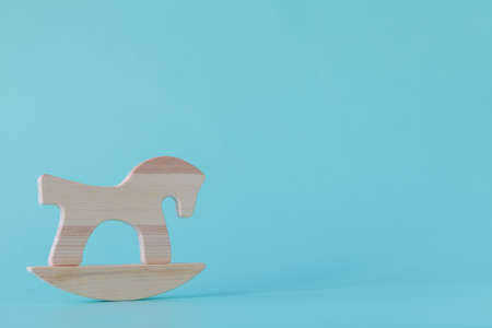 wooden horse toy isolated on aquamarineの写真素材