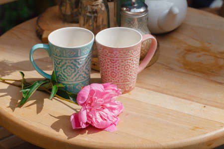 Cozy outdoor cafe with coffee cup  on the tableの写真素材