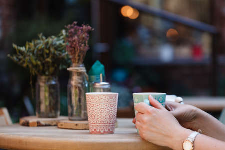 Woman's hands holding cup of coffeeの写真素材