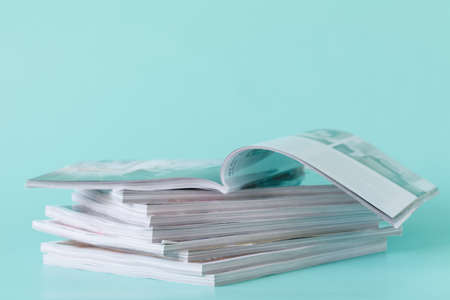 side view of a stack of magazines with glossy paperの写真素材