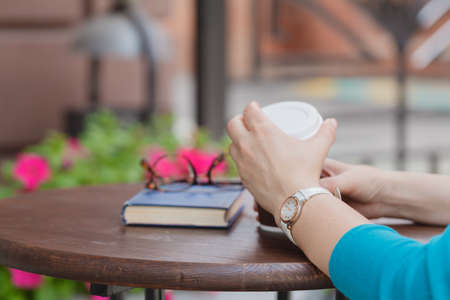 Woman Reading Book At Cafeの写真素材