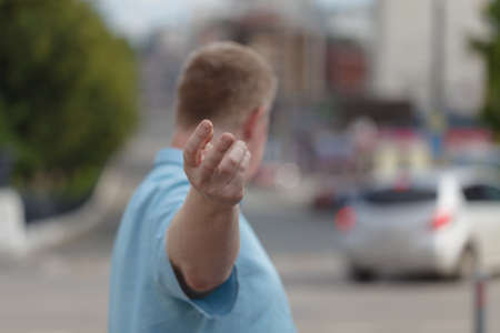 Follow me. man holding hand while showing way up