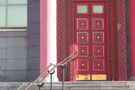 Buddhist temple gate with wooden door red color vintage style