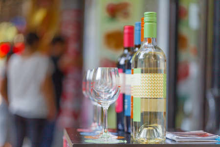 Bottle shop sells wines and offers wine tasting experiences in outdoor street barの写真素材