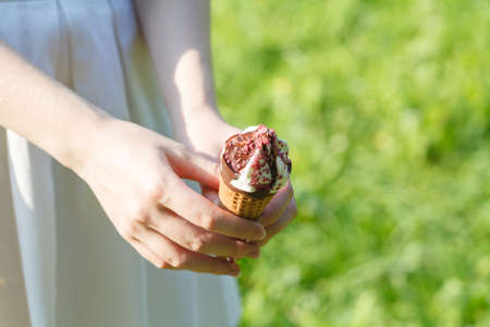 Girl Holding Ice Cream In Cup