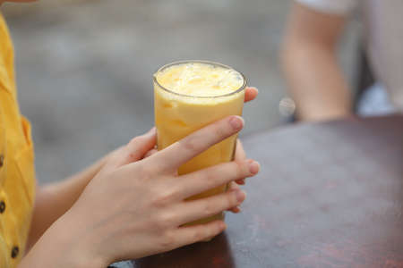 iced strawberry and orange juice in cafeの写真素材