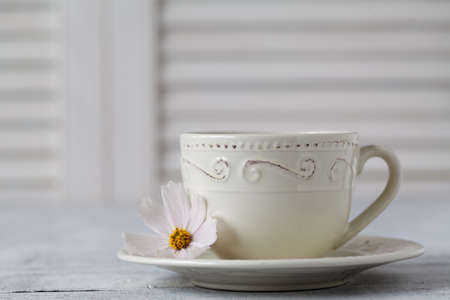 Closeup of cup of tea on wooden table with blur backgroundの写真素材
