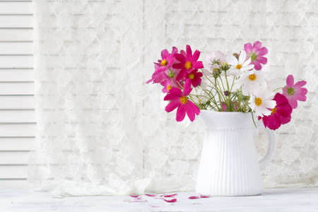 White flower bouquet in ceramic vase. Wedding decoration.の写真素材