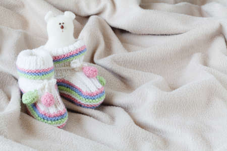 Infant anouncement concept with newborn shoes