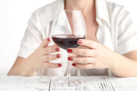 Woman testing what is the use of red wine