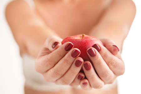 Apple in hand for youの写真素材