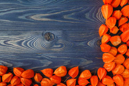 Autumn leaves on wooden boards, background of autumnの写真素材
