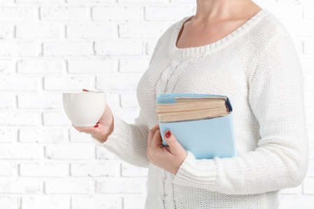 young beautiful girl reading a bookの写真素材