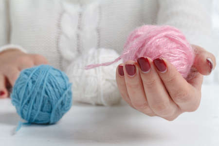 Leisure hobby concept, clew of natural wool on tableの写真素材