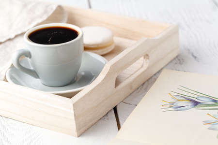 cup of tea on wooden tray on sofa in living room at homeの写真素材