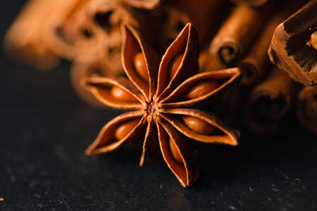 bunch of cinnamon sticks with nutmeg and anise starの写真素材