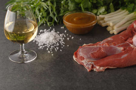 Meat and green vegetables for cooking chakapuli, a Georgian traditional dish.の写真素材