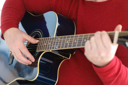 Playing guitar close up. selective focus image