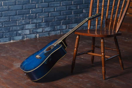 classic wooden guitar on chairs