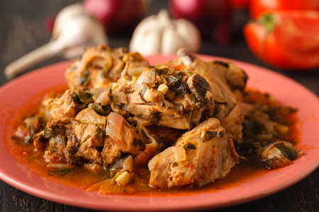 Chicken stew with vegetables and spices - chakhokhbili close-up on the tableの写真素材