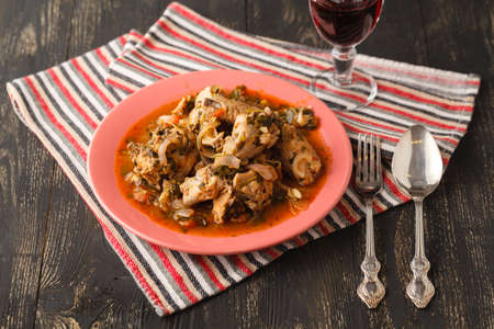Chakhokhbili chicken stew with vegetables on the table. horizontal view from aboveの写真素材