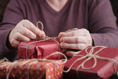 The man wraps giftsの写真素材