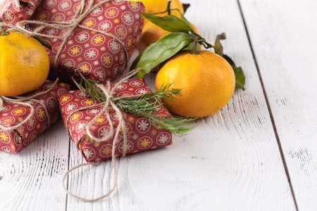 christmas gifts in red craft papper with twineの写真素材