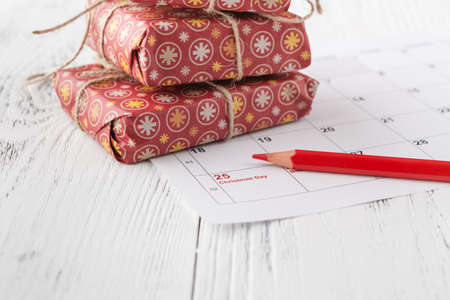 Christmas decorations and gift boxes on wooden backgroundの写真素材