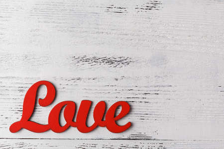 Text LOVE with valentine heart desk on the tableの写真素材