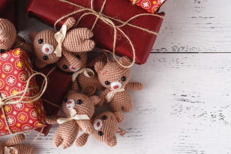 Cute teddy bear toys on a decorated gift boxes