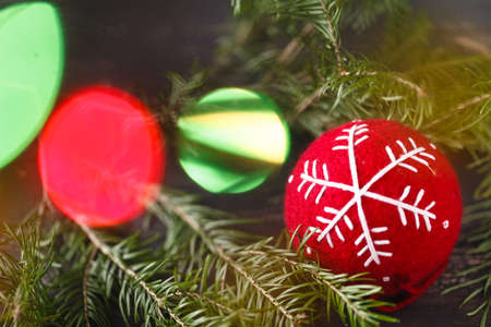 Beuatiful Christmas tree rich decorated with toys stands over presentsの写真素材