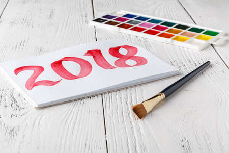 Christmas background with gift boxes and 2018 drawingの写真素材