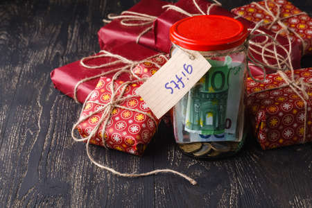 Save money for christmas gift concept with glass jarの写真素材